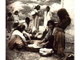 Washing-day. The rinsed garments are spread on a wall or rock to dry quickly in the sun. The soap appears to have been made of olive oil and soda with the addition of ashes . An early photograph.